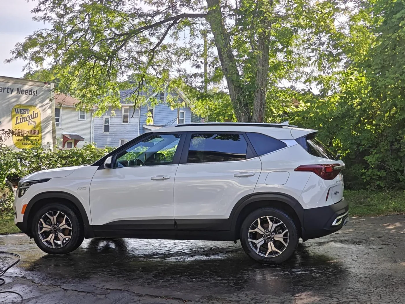 White Kia SUV after a full exterior detail