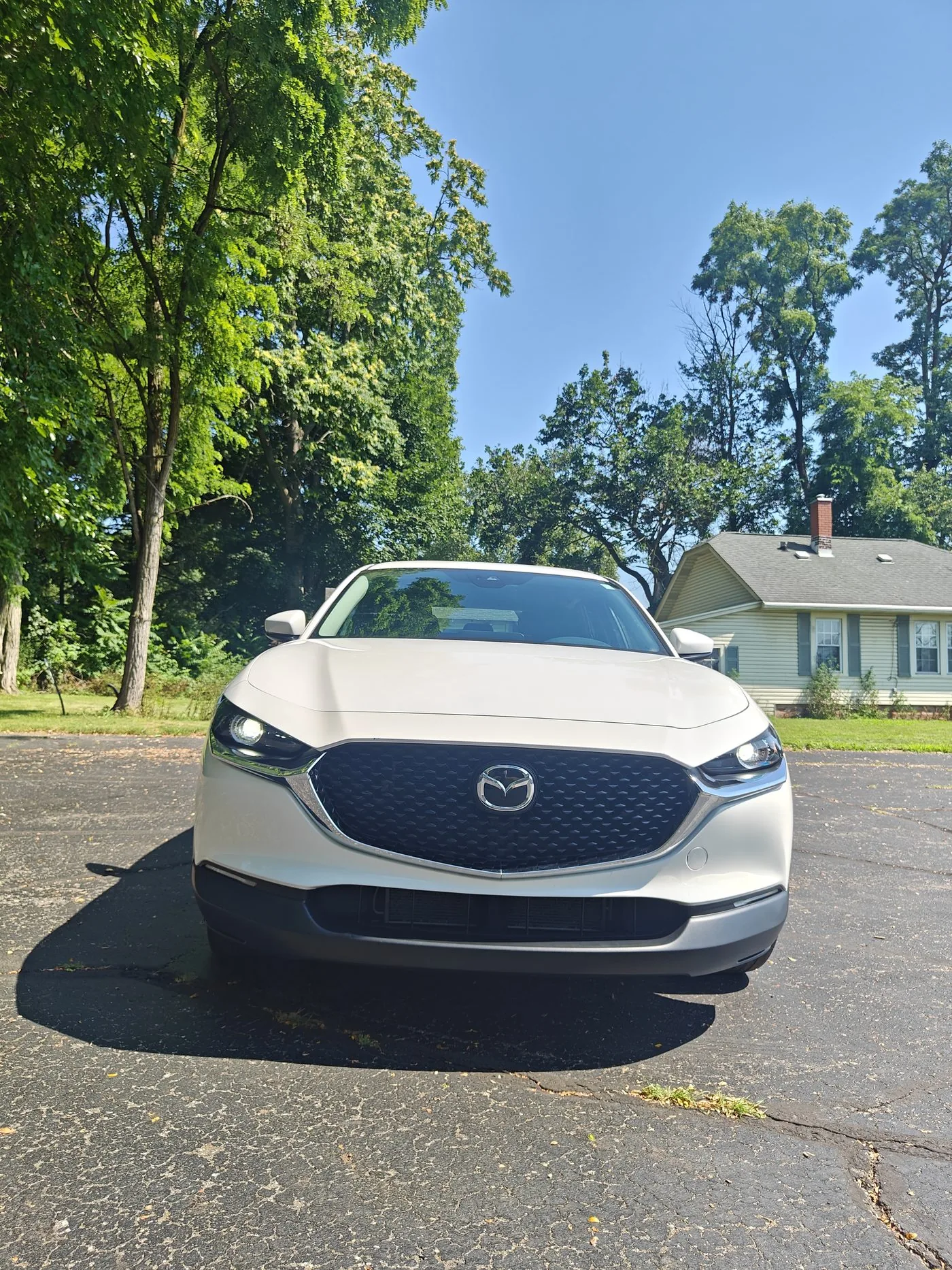 Mazda sedan front end cleaned and polished