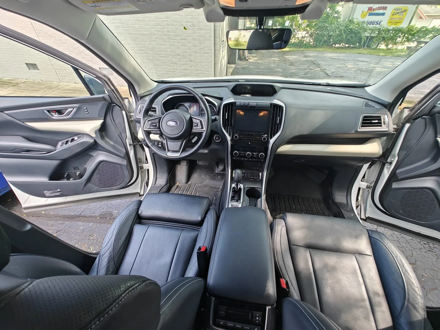 Freshly detailed car interior with conditioned seats and a clean dash