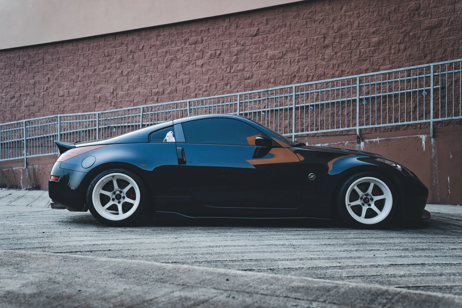 Black sports car with freshly installed ceramic window tint